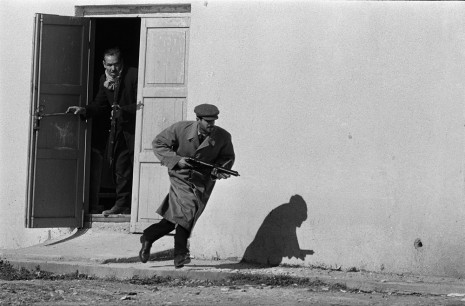 Don McCullin, Turkish defender leaving the side entrance of a cinema, Limassol, Cyprus, 1964, Gelatin silver print; printed later , Howard Greenberg Gallery