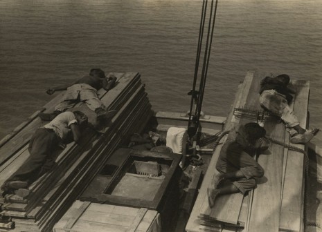 Russell Lee, Untitled, Men lying on stacks of wooden planks on boat, c. 1937 , Howard Greenberg Gallery