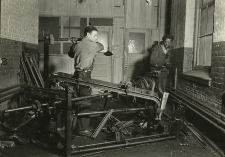 Lewis Hine, Scrap metal junkies breaking up old looms, to be sold for scrap-iron and said to be sent to Japan for munitions. Paterson, New Jersey, 1936, , Howard Greenberg Gallery