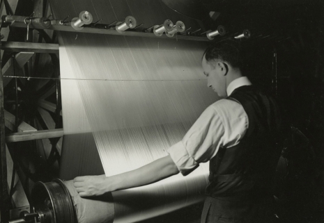 Lewis Hine, Warp threads being wound off of the frame on to the beam. Paterson, New Jersey, March 18, 1937, , Howard Greenberg Gallery