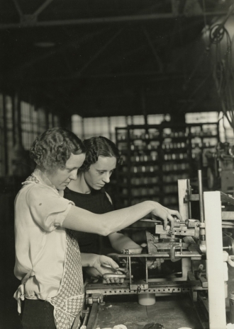 Lewis Hine, Two girls stamping glass jars in the art room at T. C. Wheaton Company. Millville, New Jersey, 1936-37, , Howard Greenberg Gallery