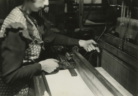 Lewis Hine, Weaver shown tying ends of broken warp threads. Paterson, New Jersey, March 18, 1937, , Howard Greenberg Gallery