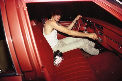 Nan Goldin , Mark in the red car, Lexington, Mass. (1979) from “The Ballad of Sexual Dependency”, 1973–86, Gagosian